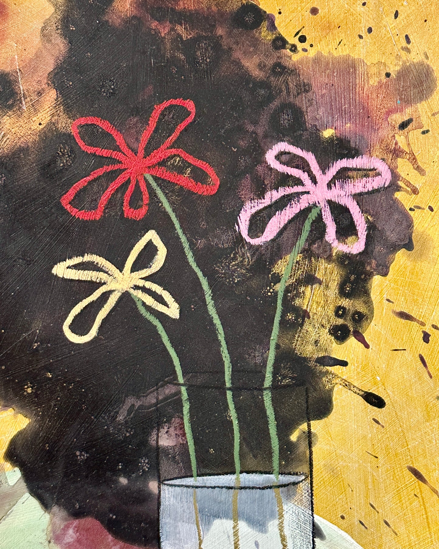 Plastic flowers in a glass with milk (witch gift)