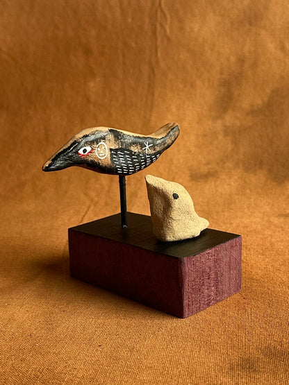 Ash pile stalker (adult and nestling)